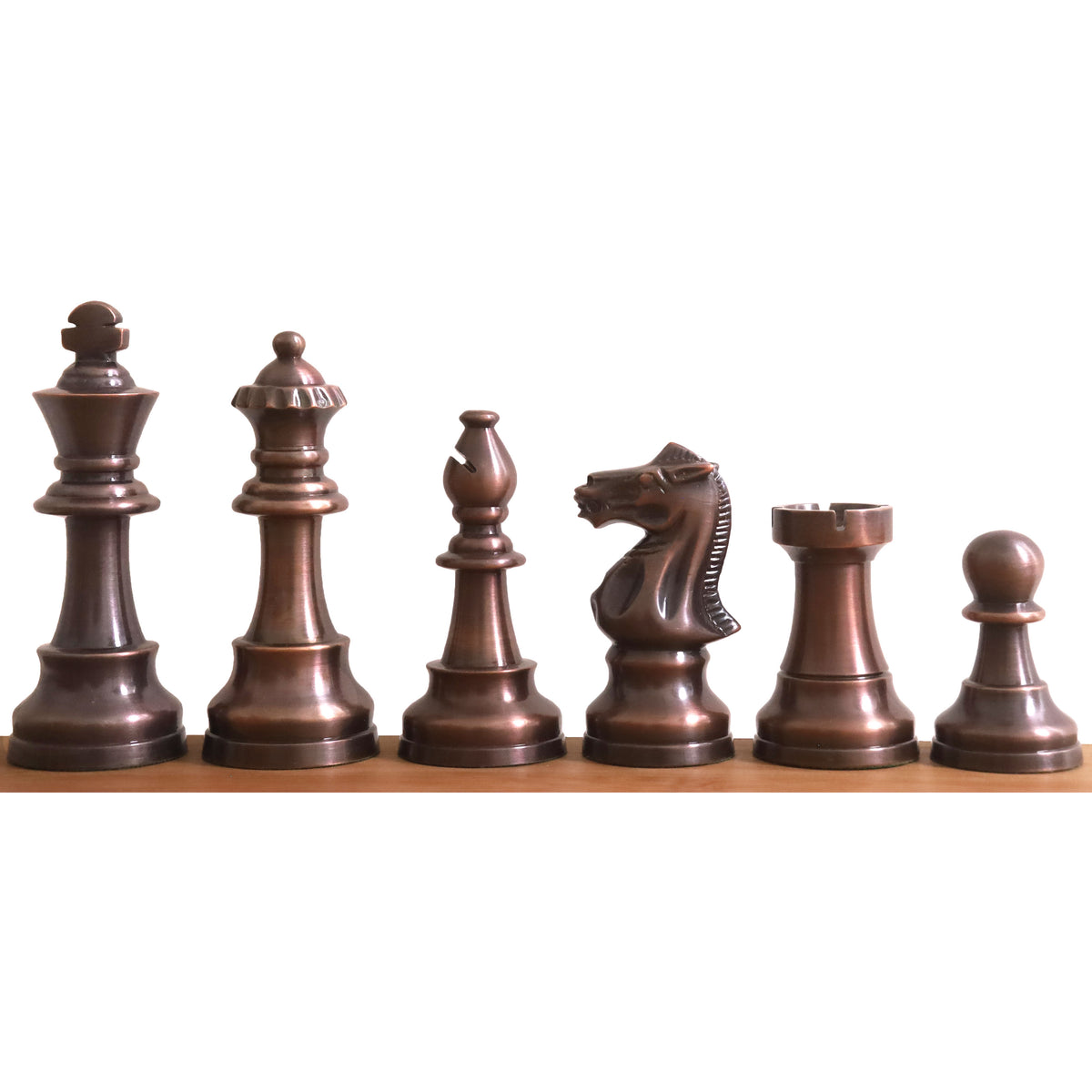 Complete lineup of copper Pro Staunton metal chess pieces arranged from king to pawn.