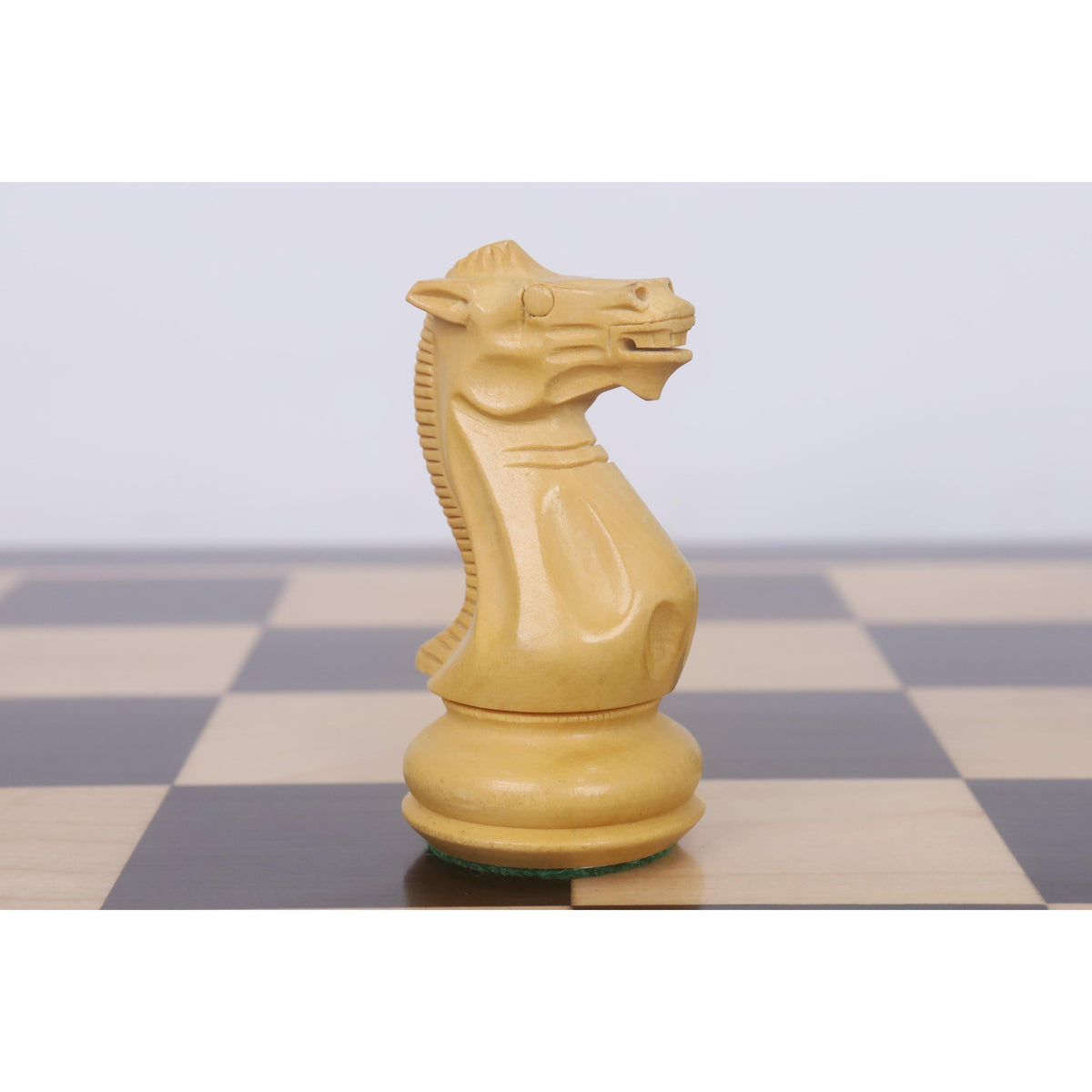 Close-up profile of a finely carved Boxwood Pro Staunton Knight.