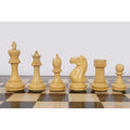 Boxwood Pro Staunton chess pieces lined up on the wooden board.