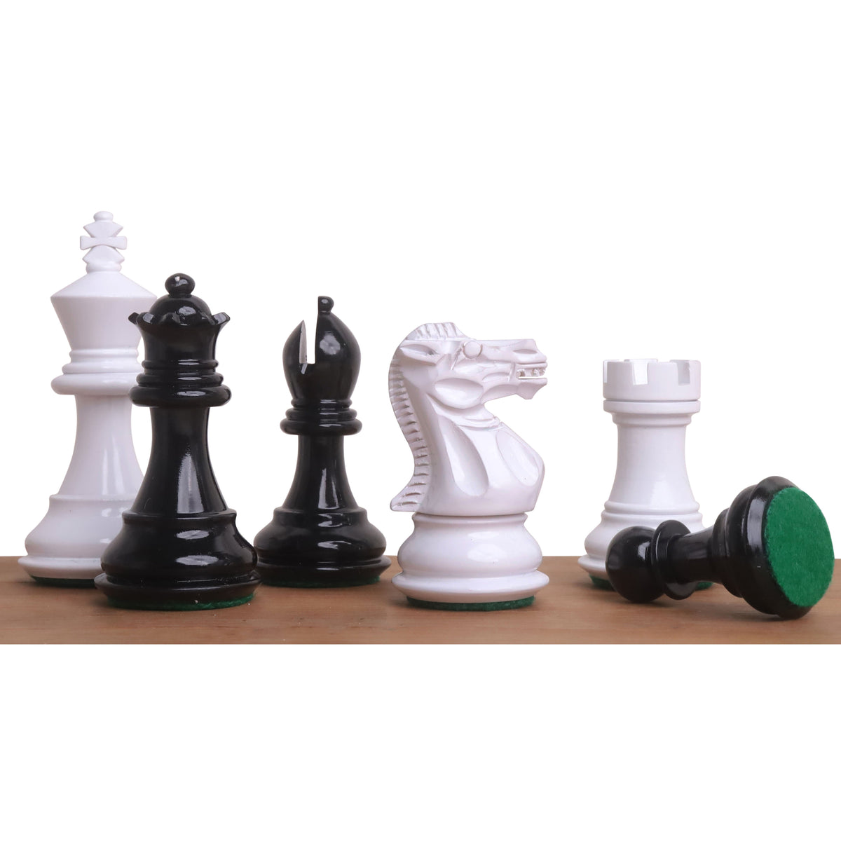 Detailed lineup of white and black Pro Staunton wooden chess pieces showing the King, Queen, Bishop, and Knight.