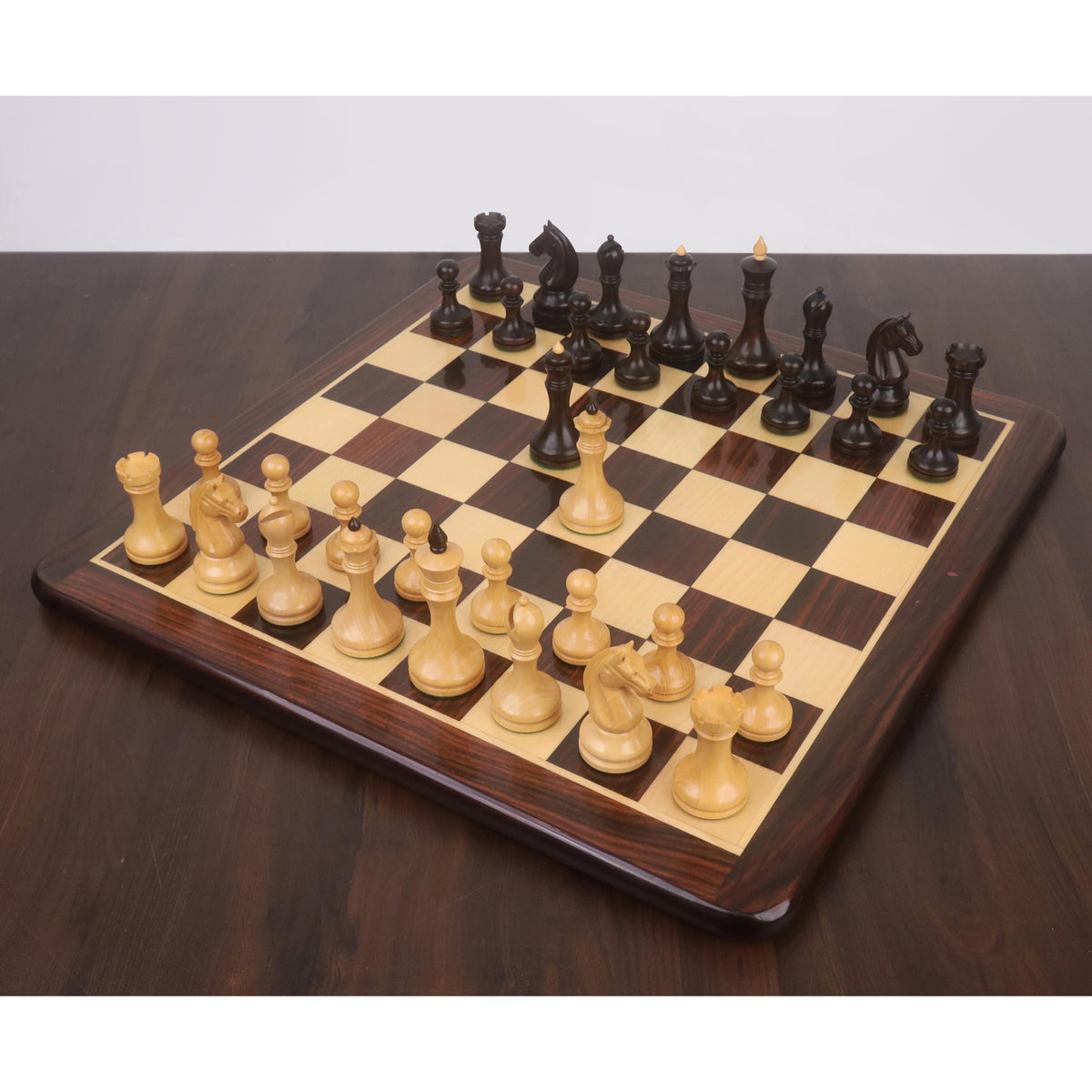 Complete 3.8" Candidates Series Minimalist chess pieces in mahogany stained boxwood set up on a chessboard.