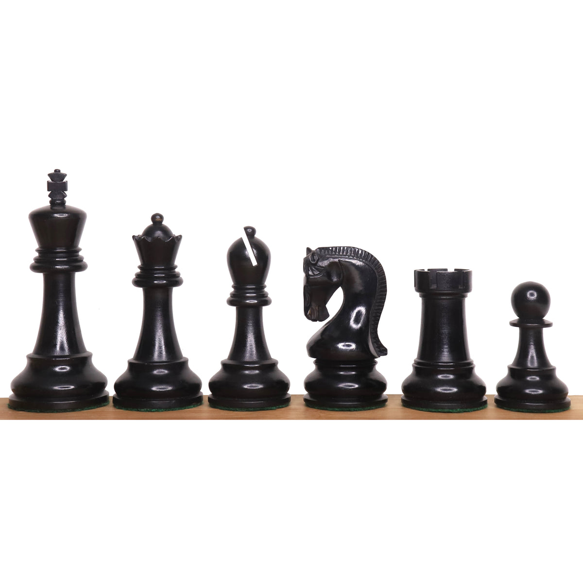 A complete set of black ebonised boxwood chess pieces from the 4-inch Leningrad Staunton collection.