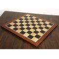 Full top-down perspective of a 21" Large Ebony and Maple Wood Chessboard with 55mm squares on a dark wooden table.