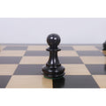 Detailed close-up of a single Ebonised Pro Staunton Pawn on a chessboard square.