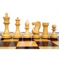 Elegant Boxwood Pro Staunton chess pieces showcased in a row on a wooden board.