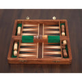 Golden rosewood travel backgammon board with handcrafted wooden checkers and playing dice.