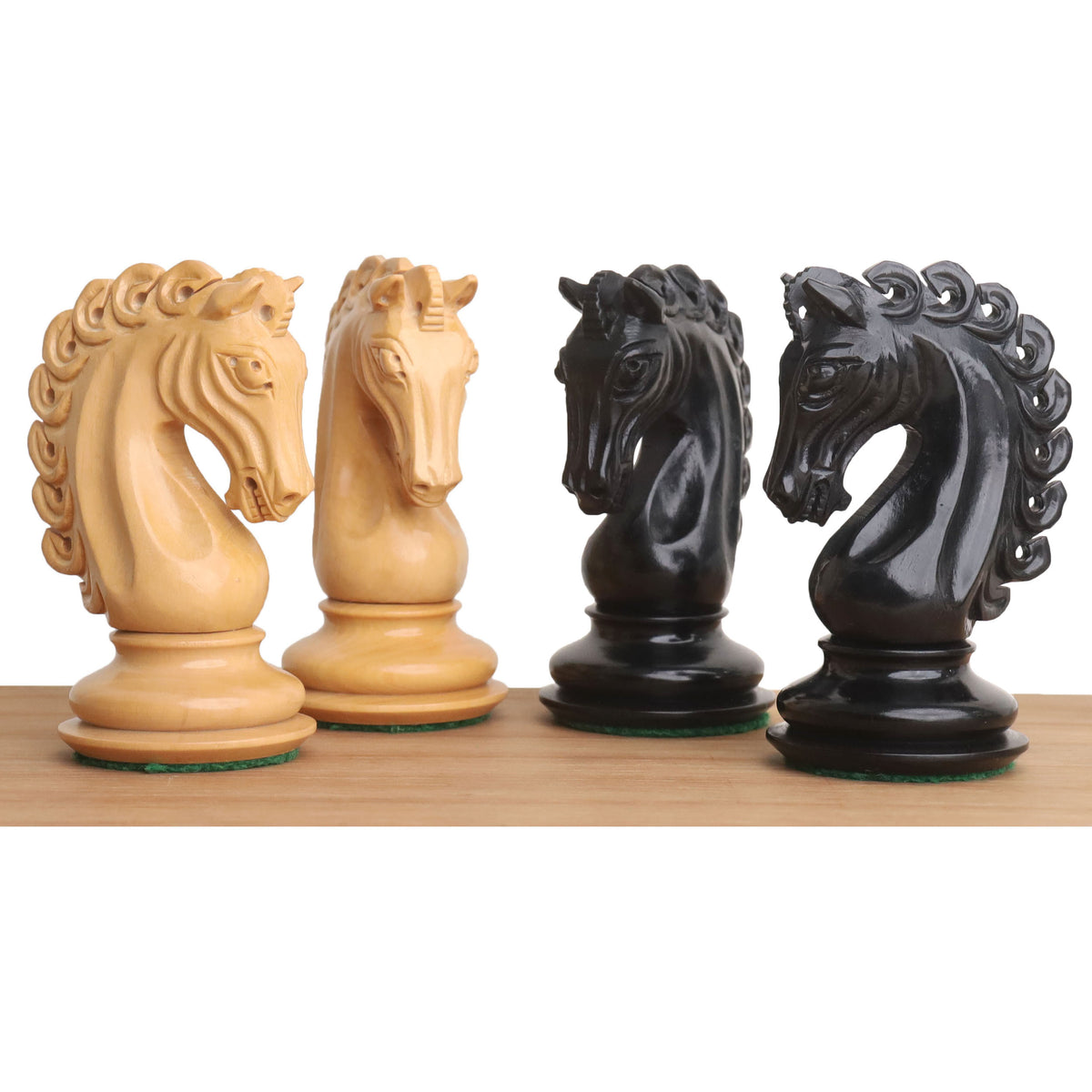 Close-up of hand-carved Avant Garde ebony and boxwood chess knights.