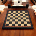 Full top-down perspective of 21 inch ebony and maple chess board with 55mm squares on a wooden table.
