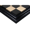 Corner view of a hand-finished ebony and boxwood chess board.