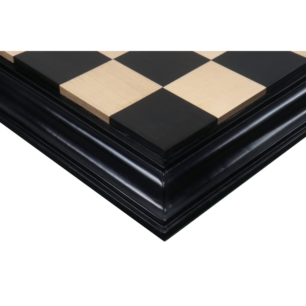 Corner view of a hand-finished ebony and boxwood chess board.