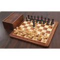 Complete Laughing Knight Staunton chess set with ebonised pieces and wooden storage box on a chess board.