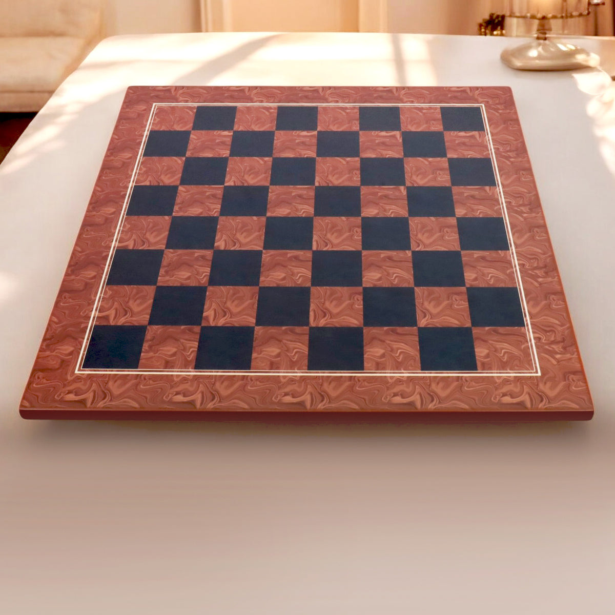 A 22-inch Brown Ash Burl and Burl Ebony printed chess board displayed in a bright, elegant home interior setting.