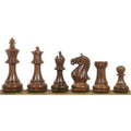 Complete set of golden rosewood Staunton chess pieces lined up in order.