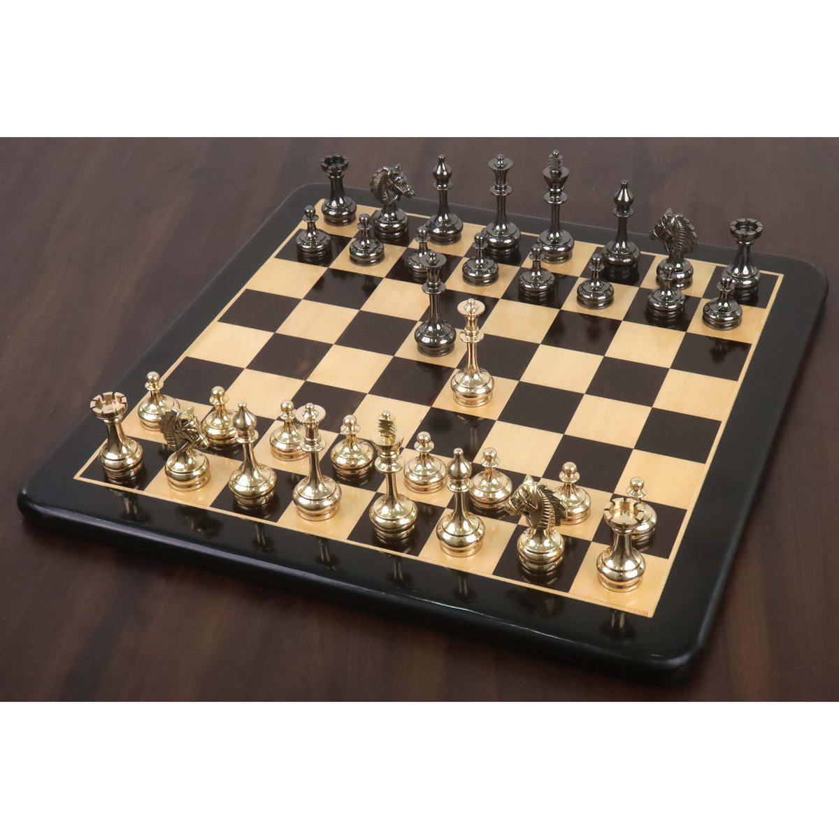 3.7" Splendor Series brass metal luxury chess set in gold and metallic grey, arranged for play on a wooden chessboard.