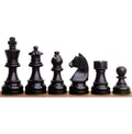 Lineup of 3.3" Ebonised Staunton chess pieces.