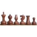 Dark Acacia wood Staunton chess pieces including King, Queen, and Knight in a row.