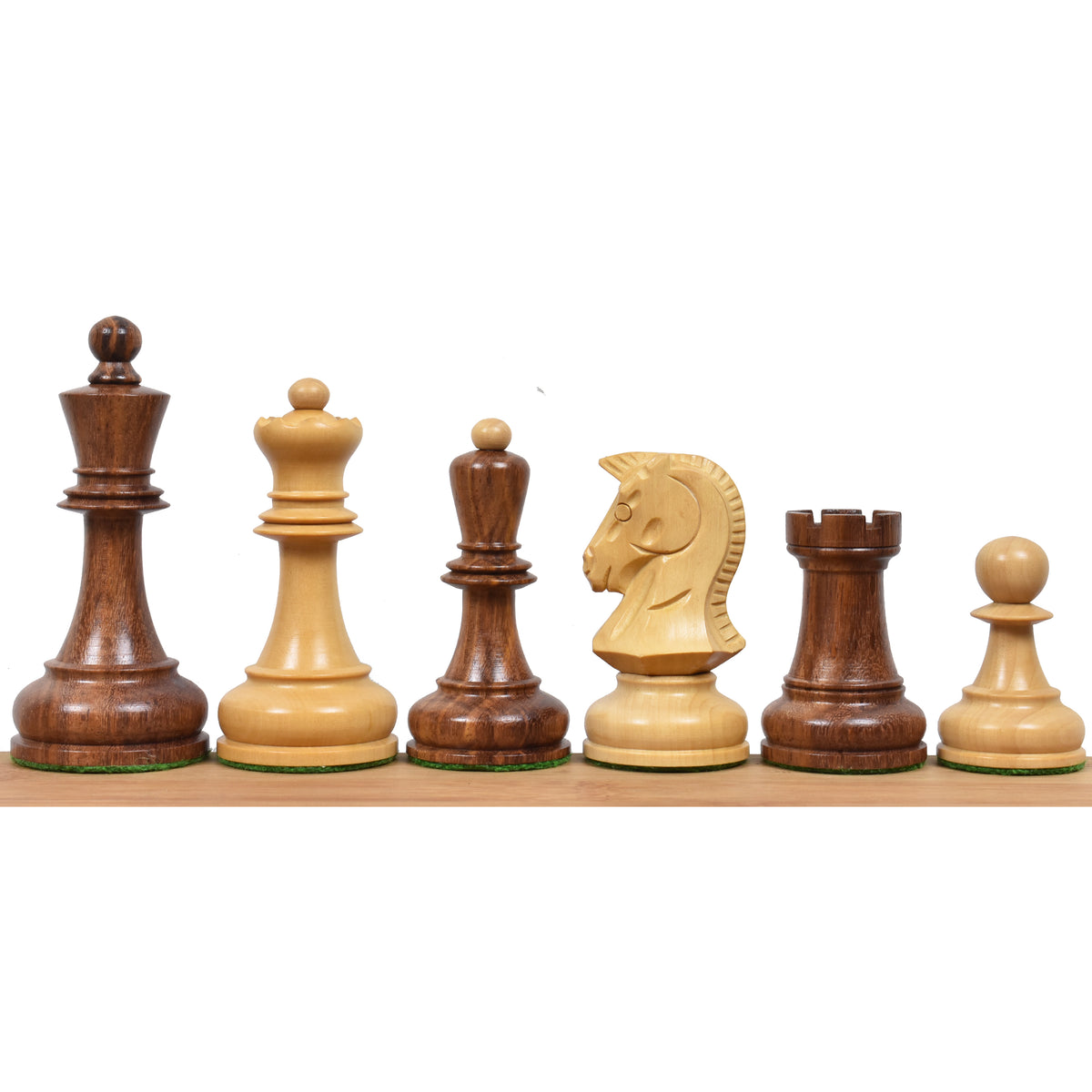 Golden rosewood and boxwood Dubrovnik chess pieces lined up on a display board.