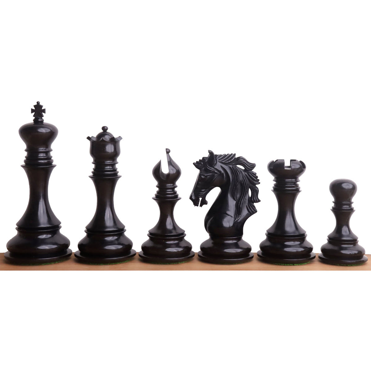 An eye-level lineup of all six individual Goliath Series weighted Ebony Staunton chess pieces, showing their precise craftsmanship and design.