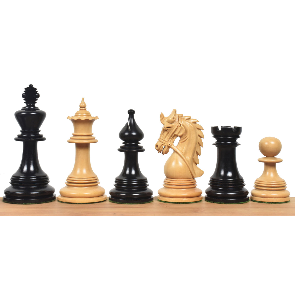 Napoleon luxury Staunton chess pieces in dark ebony and natural boxwood lined up on a wooden base.
