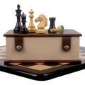 Alban Staunton chess set combo showing pieces on a leatherette storage box resting on a wooden chessboard.
