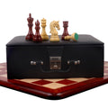 Black storage box and 3.8" Imperial Staunton chess pieces resting on a 21" Bud Rosewood chess board.
