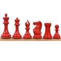 A complete set of red painted boxwood Staunton chess pieces.