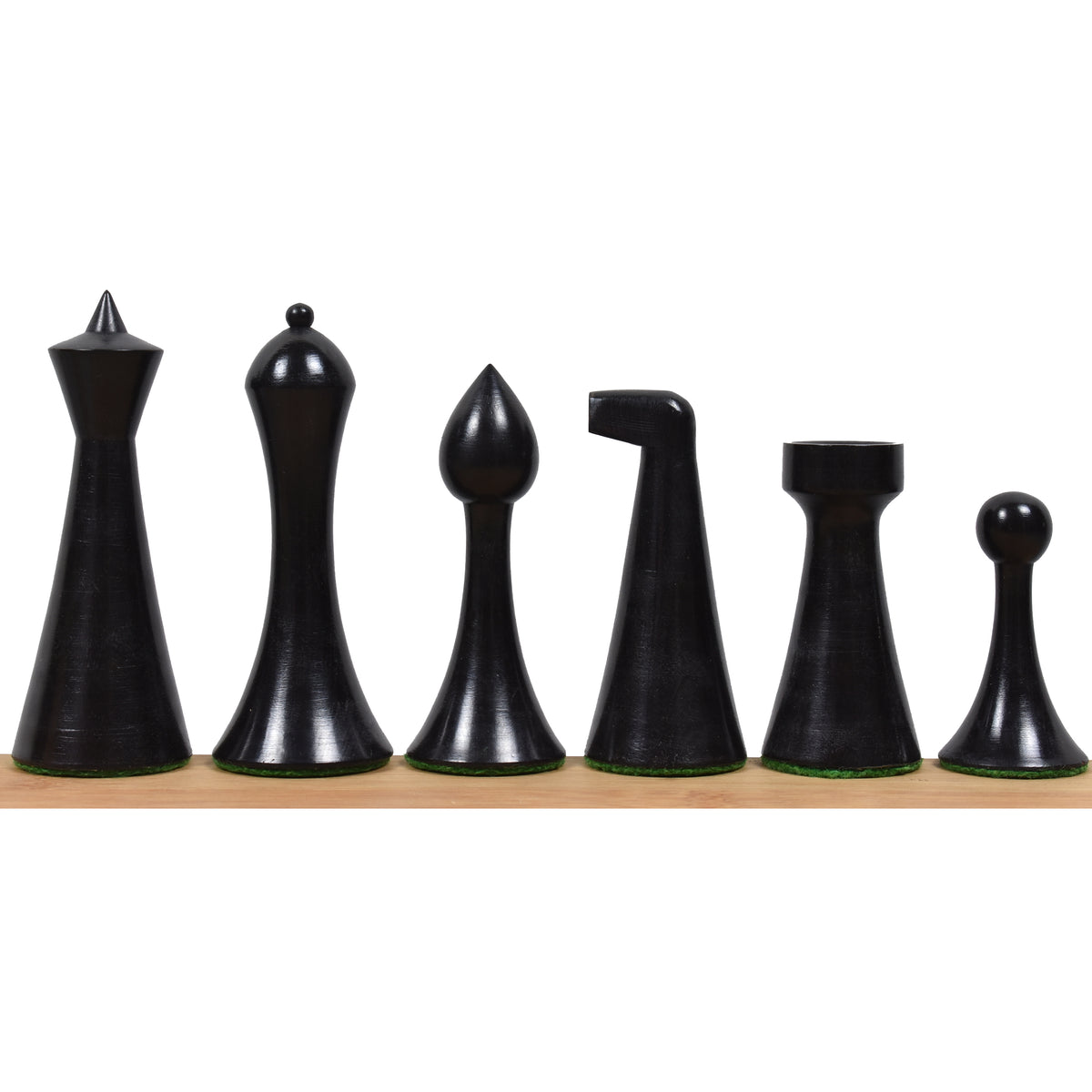 Ebonised boxwood Herman Ohme chess pieces including king, queen, bishop, knight, rook, and pawn.