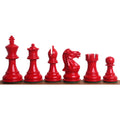 Complete set of gloss red painted Pro Staunton style wooden chess pieces.