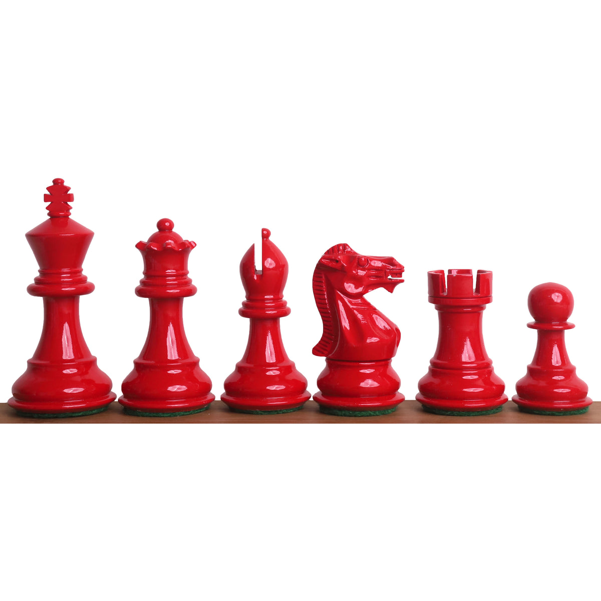 Complete set of gloss red painted Pro Staunton style wooden chess pieces.
