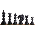 Complete set of six dark ebony wood Staunton chess pieces including king, queen, knight, and pawn.
