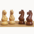 Carved fierce knight Staunton chess pieces in boxwood and golden rosewood.