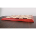 Side profile of a luxury Bud Rosewood chessboard showing the raised carved border and solid wood construction.
