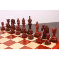 Intricately carved 4.5-inch budrose wood chess pieces on a luxury board.