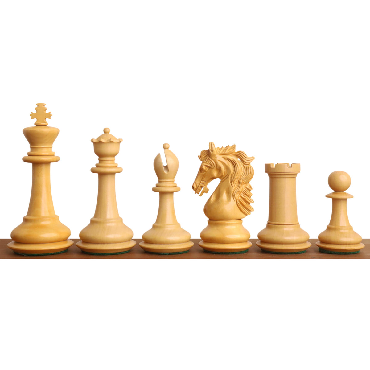 Individual light-colored Boxwood Heritage Series Staunton chess pieces in a row.