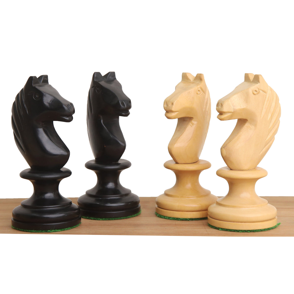 Detailed view of handcrafted ebonised boxwood and natural boxwood Averbakh knight pieces.
