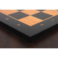 Low-angle side view highlighting the thick build and crisp notations of the antique boxwood and ebony wooden chess board.
