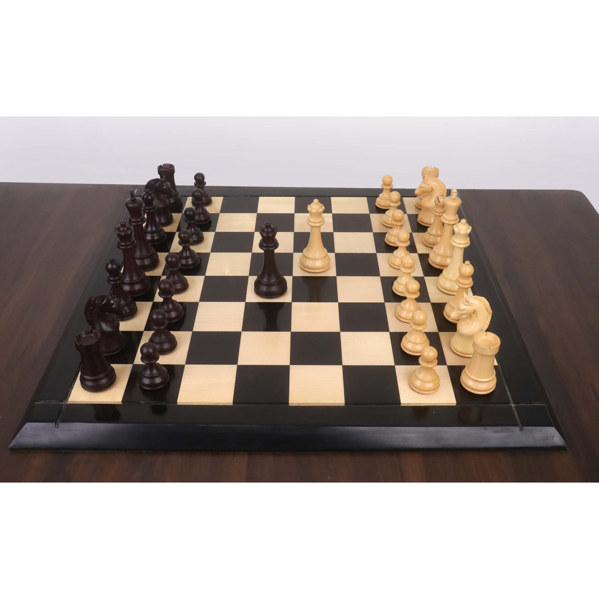 A full Piatigorsky Cup reproduction chess set arranged on a tournament-sized wooden board.