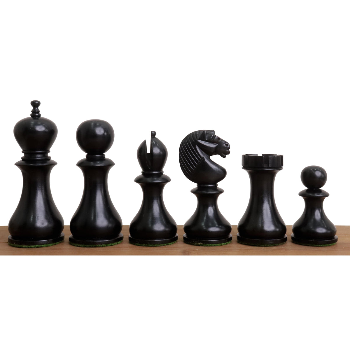 Black Ebonised Boxwood English Dublin chess pieces lined up in a row from King to Pawn.
