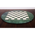Side profile of a 24-inch circular luxury chess board made of green marble and semi-precious stones, highlighting its sleek, polished edge.