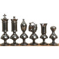 Grey variant of the giant Victorian series brass metal luxury chess pieces displayed in a structured row.