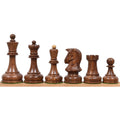 Full set of golden rosewood Dubrovnik chess pieces arranged in a row.