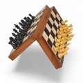 Upside-down ebony and maple magnetic travel chess board demonstrating the powerful grip holding all pieces in place.