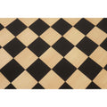Detailed view of the wooden border and corner joinery on a premium ebony and maple chess board.