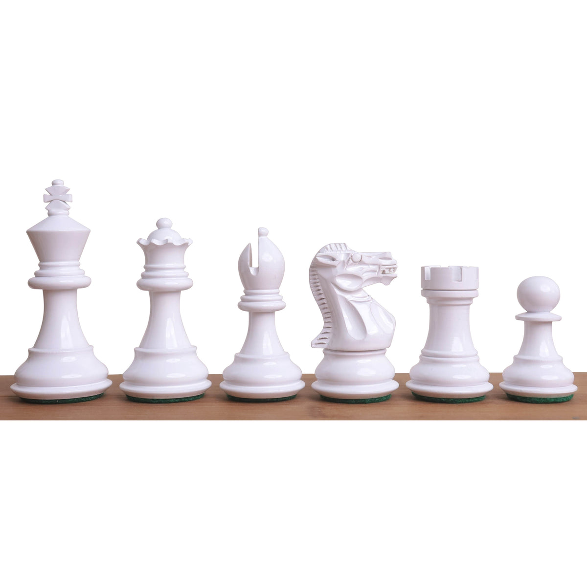 A complete row of white Pro Staunton painted wooden chess pieces from King to Pawn on a wooden surface.