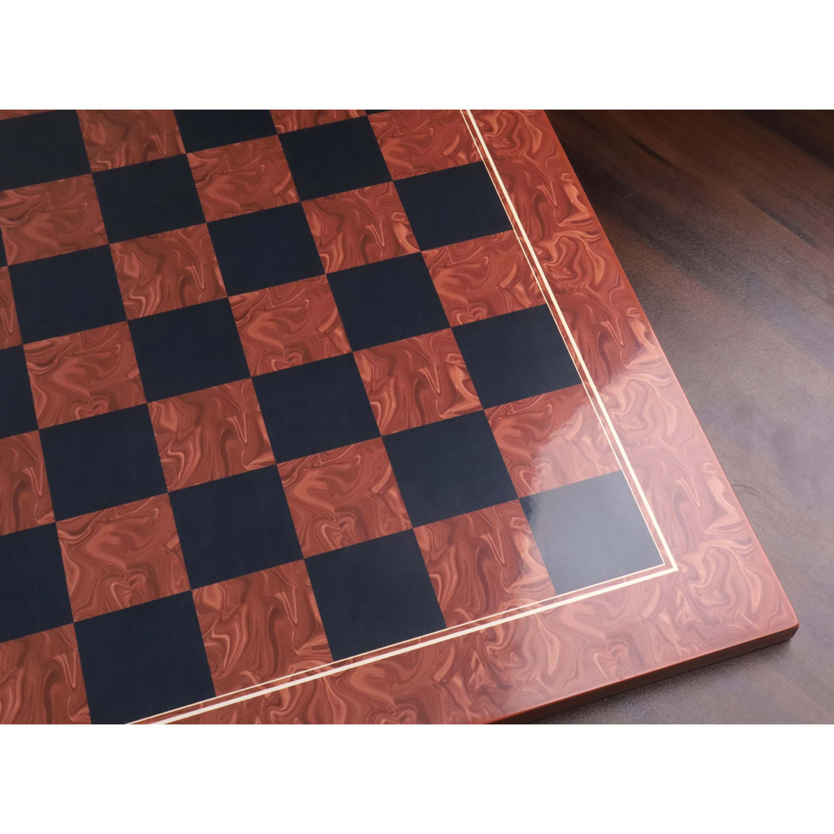 High-angle shot highlighting the high-gloss finish and reflective surface of the Brown Ash Burl and Ebony printed chess board.