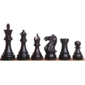 Six premium triple-weighted ebony wood chess pieces standing in a straight row against a white backdrop.