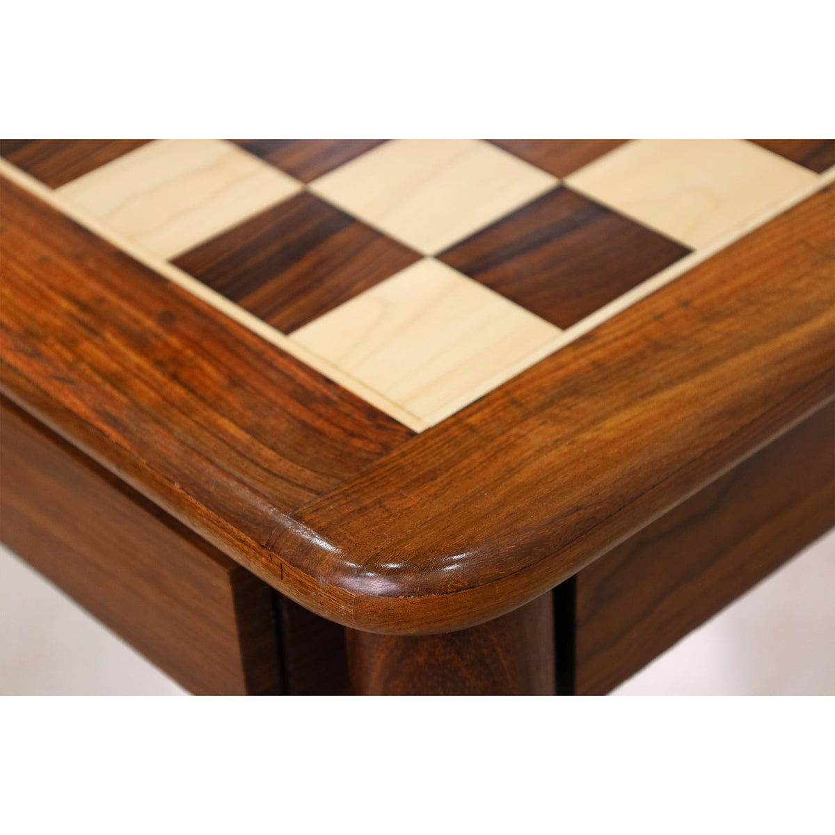 Close-up of the inlaid chess board surface featuring premium Golden Rosewood and Maple squares with a smooth polished finish.