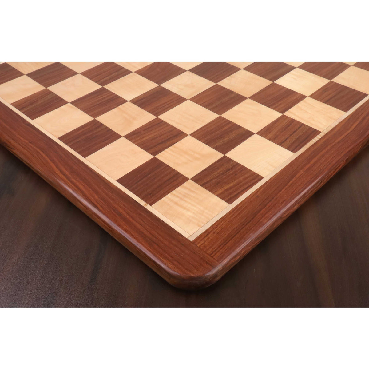 Angled view of the luxury wooden chess board featuring 65mm squares and a thick solid wood border.