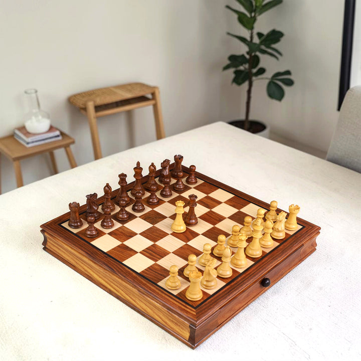 Luxury 15-inch golden rosewood magnetic travel chess set displayed on a white table.