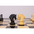 Detailed ebony and boxwood knight chess pieces facing each other